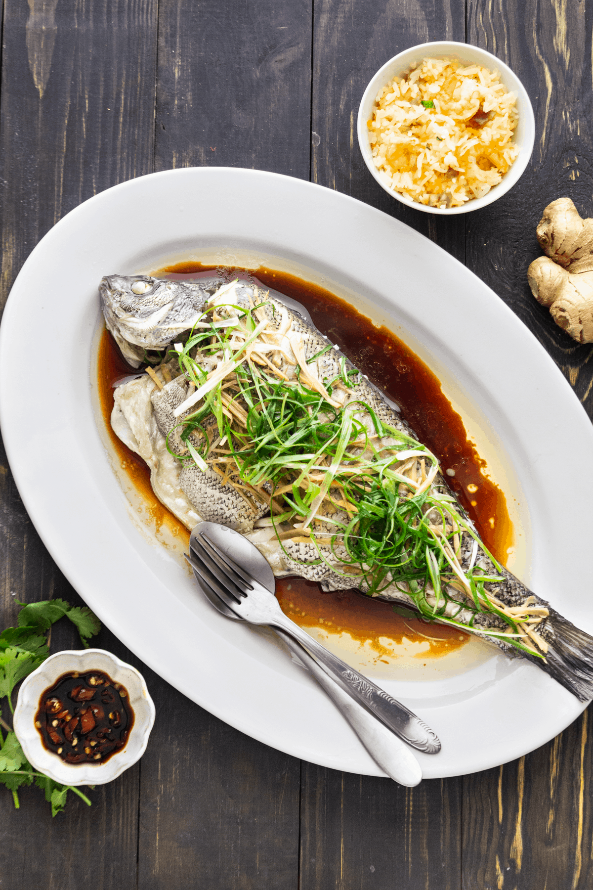 https://www.wokandkin.com/wp-content/uploads/2021/05/Steamed-Fish-with-Ginger-and-Shallots-saved-for-web-1200px.png